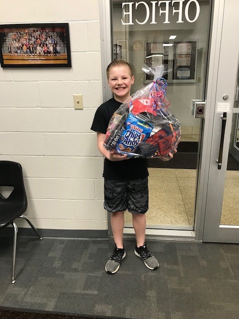 boy holding a prize basket